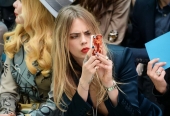 Cara Delevingne wearing Burberry AW14 Teal Blue nail varnish on the front row of the Burberry Prorsum Spring_Summer 2015 Show