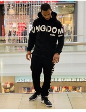 Victor Cruz wearing the Kingdom-print hooded sweatshirt